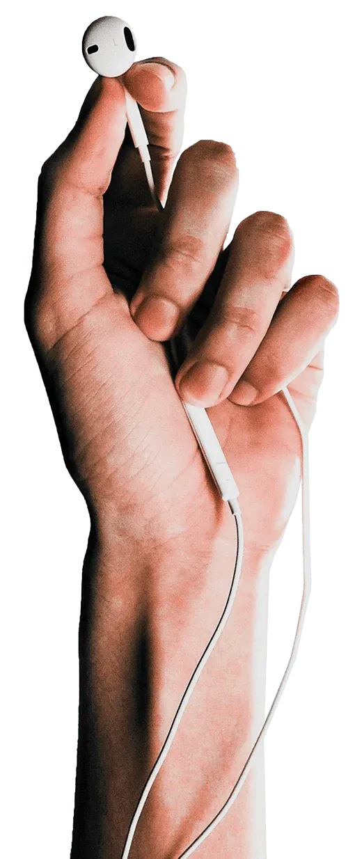 A hand holding earbuds